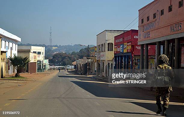 Malawian soldier patrols the deserted streets of Lilongwe, on July 21 a day after mass protests against Malawi's President Bingu wa Mutharika....