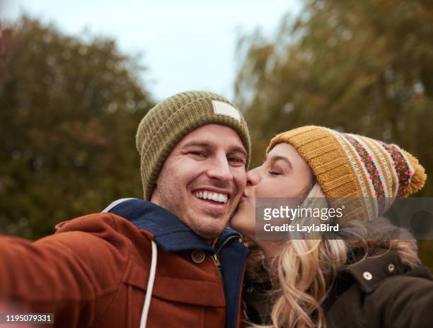 i treasure these cheek kisses of hers - i love my wife stock pictures, royalty-free photos & images