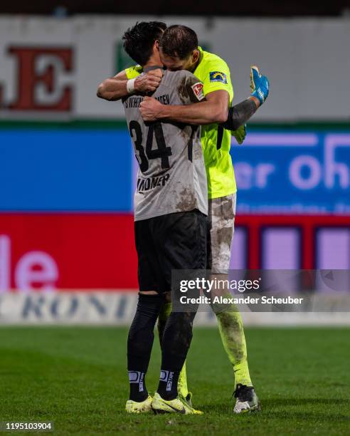 Heinz Linder of Wiesbaden and Benedikt Roecker of Wiesbaden celebrate the victory during the Second Bundesliga match between Karlsruher SC and SV...