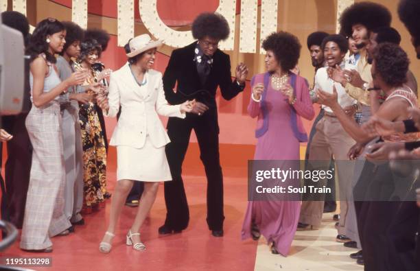 Don Cornelius dances down the Soul Train Line with Jean Terrell and Lynda Laurence of the Supremes on Soul Train episode 62, aired 5/26/1973. .