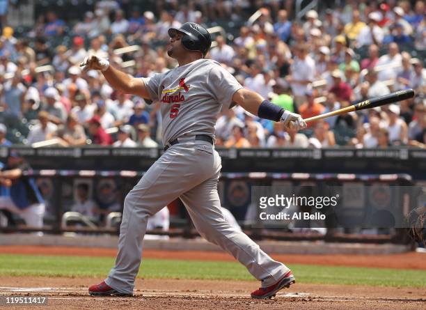 Albert Pujols of the St. Louis Cardinals hits a two run home run against Jonathon Niese of the New York Mets in the first inning of their game on...