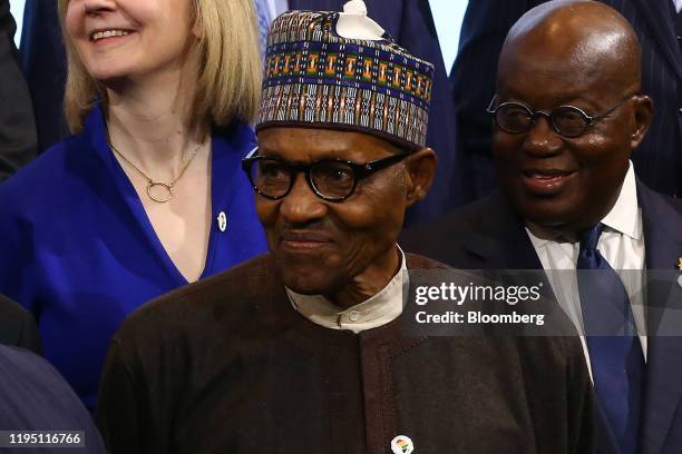 Muhammadu Buhari, Nigeria's president, takes part in a family photo with leaders of African countries at the U.K. - Africa Investment Summit at the...