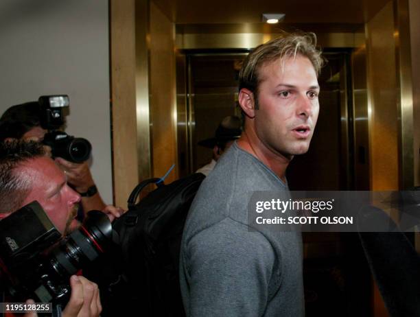 New York Yankees relief pitcher Steve Karsay ducks past photographer on his way into the Major League Baseball Player Association meeting in Chicago...
