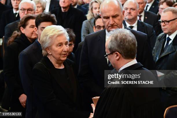 Protestant regional bishop Christian Staeblein greets the widow of the deceased, Ingrid Stolpe, joined by Dietmar Woidke, state premier of...