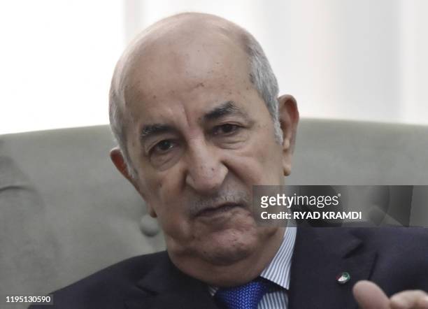 Algerian President Abdelmadjid Tebboune meets with the visiting French Foreign Minister in the capital Algiers on January 21, 2020. - Le Drian...