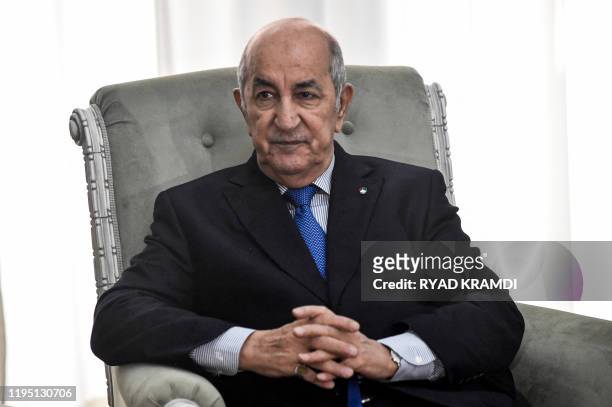 Algerian President Abdelmadjid Tebboune meets with the visiting French Foreign Minister in the capital Algiers on January 21, 2020. - Le Drian...