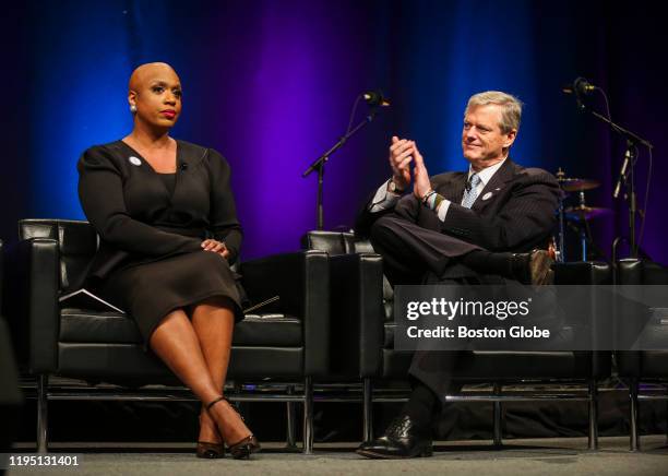 Congresswoman Ayanna Pressley is applauded by Governor Charlie Baker during a panel conversation at the annual MLK Memorial Breakfast, the nation's...