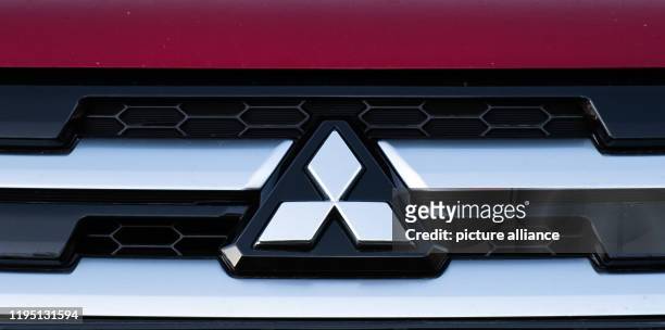 January 2020, Hessen, Friedberg: The logo of the Japanese car manufacturer Mitsubishi Motors can be seen on an SUV at the Friedberg site. The public...