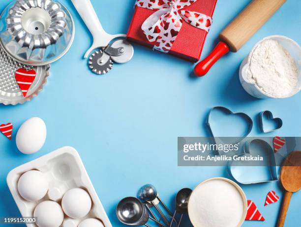 baking background frame. preparation for valentines day baking. ingredients and kitchen items for baking. kitchen utensils, flour, eggs, sugar. - rolling pin stock pictures, royalty-free photos & images