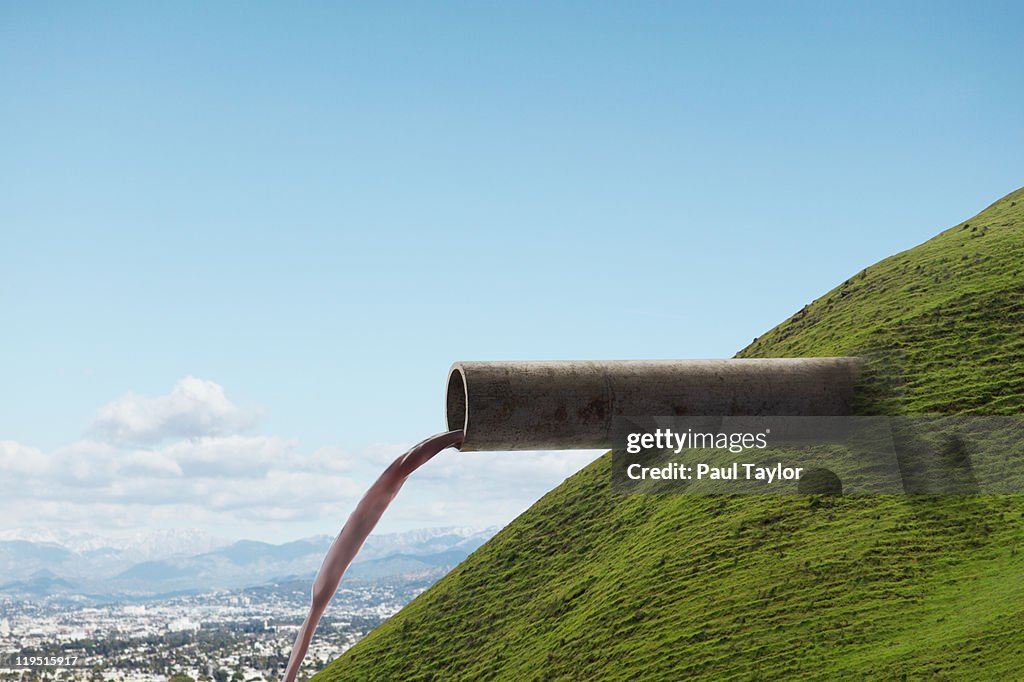 Pipe Emerging from Hillside