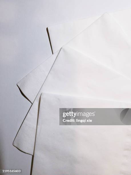 three paper napkin on the table - paper napkin fotografías e imágenes de stock