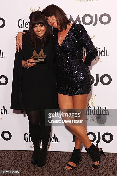 Sandie Shaw poses with Rumer after presenting her with the MOJO Breakthrough Award in front of the winners boards at the Glenfiddich Mojo Honours...