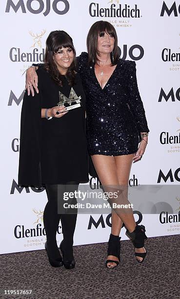 Rumer and Sandie Shaw pose in front of the winners boards with the MOJO Breakthrough Award at the Glenfiddich Mojo Honours List 2011 awards ceremony...