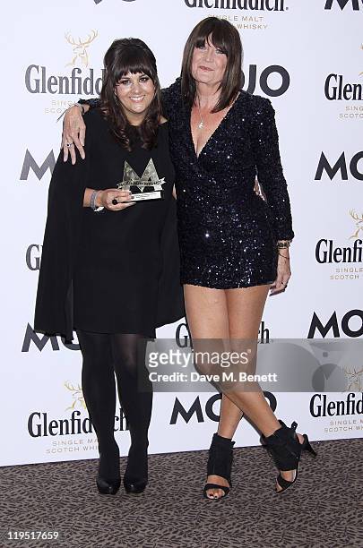 Rumer and Sandie Shaw pose in front of the winners boards with the MOJO Breakthrough Award at the Glenfiddich Mojo Honours List 2011 awards ceremony...
