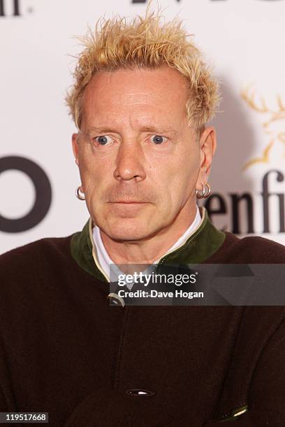 Johnny Rotton poses in front of the winners boards after accepting the Outstanding Contribution to Music Award for PiL at the Glenfiddich Mojo...