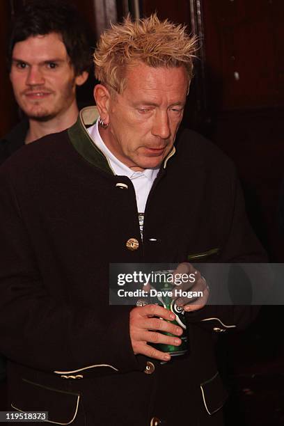 Johnny Rotton poses in front of the winners boards after accepting the Outstanding Contribution to Music Award for PiL at the Glenfiddich Mojo...