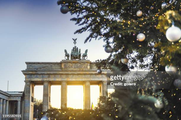 brandenburger tor behind christmas tree - berlin stock pictures, royalty-free photos & images