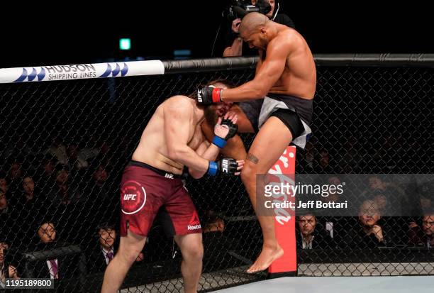 Ciryl Gane of France lands a flying knee against Tanner Boser in their heavyweight fight during the UFC Fight Night event at Sajik Arena 3 on...
