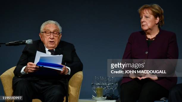 Former US Secretary of State Henry Kissinger holds the laudatio for German Chancellor Angela Merkel who receives the "Henry A Kissinger prize" at the...