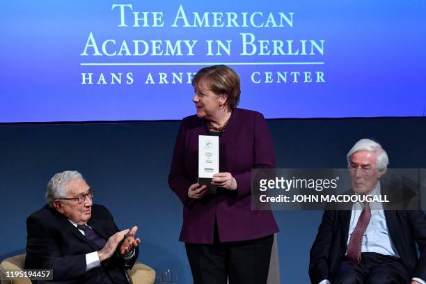 German Chancellor Angela Merkel receives the "Henry A Kissinger prize" next to former US Secretary of State Henry Kissinger and Gerhard Casper ,...