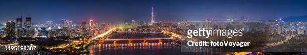 seoul glittering cityscape skyscraper skyline aerial panorama neon night korea - lotte world tower stock pictures, royalty-free photos & images