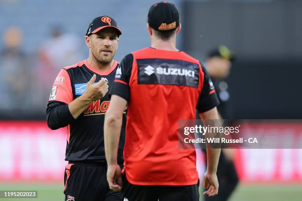 Michael Klinger, Head coach of the Renegades speaks with Aaron Finch of the Renegades during the Big Bash League match between the Perth Scorchers...