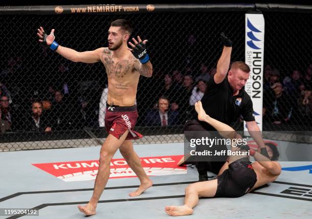 Charles Jourdain of Canada celebrates after knocking out Dooho Choi of South Korea in their featherweight fight during the UFC Fight Night event at...