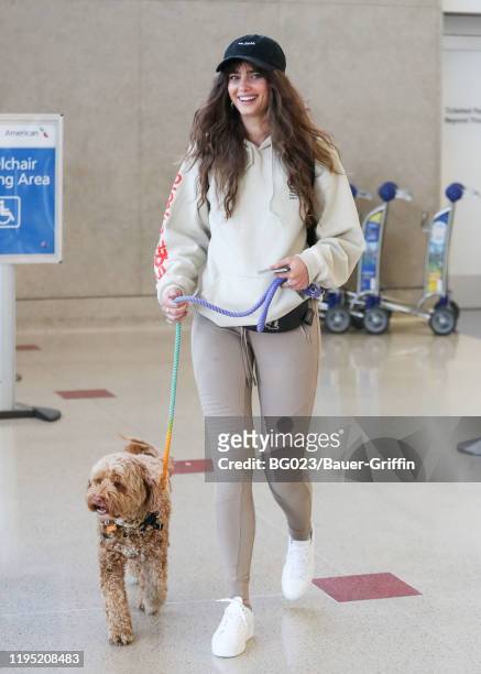 Victoria's Secret Angel Taylor Hill is seen with her dog, Tate on January 21, 2020 in Los Angeles, California.