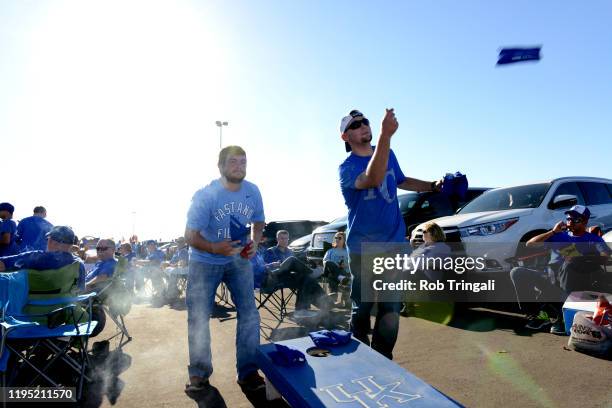 Two Kansas City Royals fans play cornhole before Game 1 of the 2014 World Series between the San Francisco Giants and Kansas City Royals on Tuesday,...