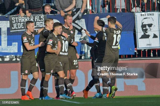 Players of St. Pauli celebrate their teams second goal with Henk Veerman during the Second Bundesliga match between FC St. Pauli and DSC Arminia...