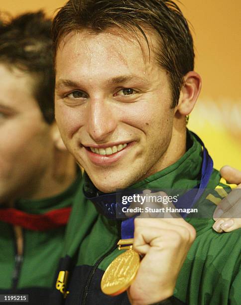 Ian Thorpe of Australia with his gold medal after breaking the world record in the Men's 400M Freestyle final from the Manchester Aquatics centre...