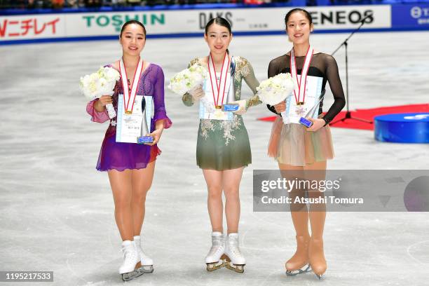 Wakaba Higuchi , Rika Kihira and Tomoe Kawabata of Japan pose with their medals during day three of the 88th All Japan Figure Skating Championships...