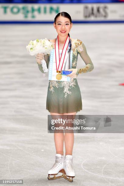 Rika Kihira of Japan poses with her gold medal during day three of the 88th All Japan Figure Skating Championships at the Yoyogi National Gymnasium...