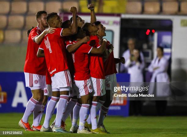 Matheus Monteiro of Internacional celebrates a scored goal with his teammates during a match between Internacional and Corinthians as part of...