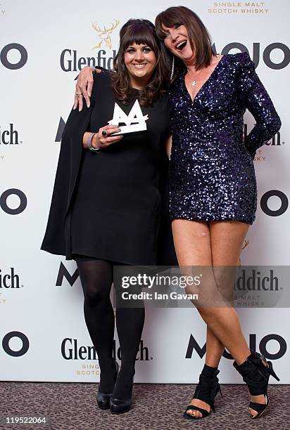 Rumer poses in front of the winners boards after winning the MOJO Breakthrough Award with Sandie Shawat the Glenfiddich Mojo Honours List 2011 at The...