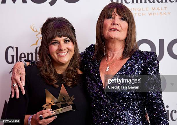 Rumer poses in front of the winners boards after winning the MOJO Breakthrough Award with Sandie Shawat the Glenfiddich Mojo Honours List 2011 at The...