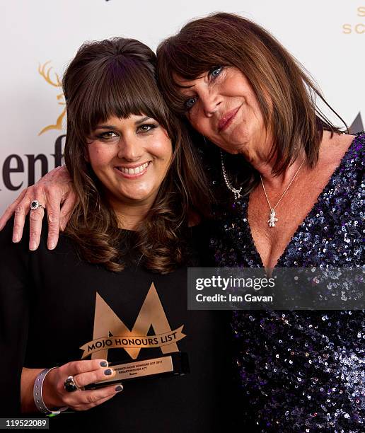 Rumer poses in front of the winners boards after winning the MOJO Breakthrough Award with Sandie Shawat the Glenfiddich Mojo Honours List 2011 at The...