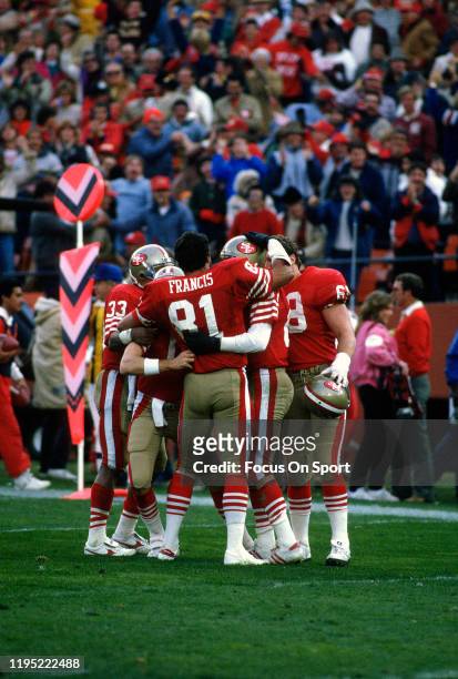 Dwight Clark, Russ Francis and Roger Craig of the San Francisco 49ers celebrates after the 49ers scored against the Dallas Cowboys during an NFL...