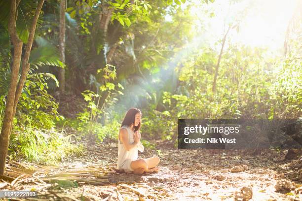 serene woman meditating in sunny, tranquil woods, sayulita, nayarit, mexico - forest bathing stock pictures, royalty-free photos & images