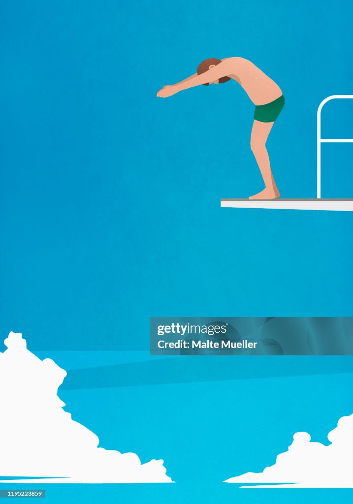 Man preparing to dive off platform
