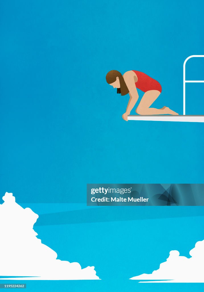 Anxious woman at the edge of diving platform, looking down