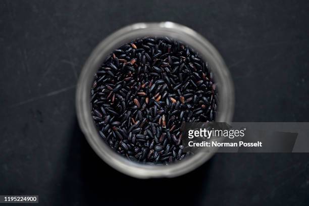 view from above black rice in spice jar - black rice stock pictures, royalty-free photos & images