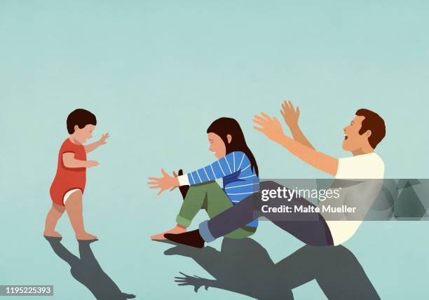 happy couple cheering for baby son taking first steps - baby boys stock illustrations