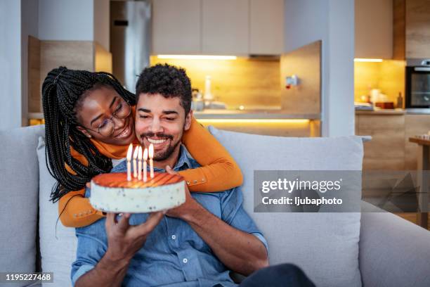 here's to many more birthdays with you - man giving cake candle stock pictures, royalty-free photos & images