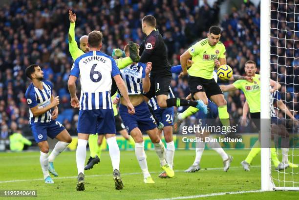 John Egan of Sheffield United scores a goal which is then disallowed following a VAR review during the Premier League match between Brighton & Hove...