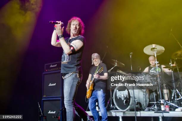 Carl Sentance, Jimmy Murrison and Lee Agnew of the British band Nazareth perform live on stage during the concert Music & Stories at the Tempodrom on...