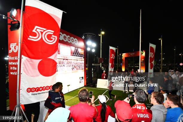 Fans enjoy the Ooredoo brand activation in the fan area before the FIFA Club World Cup 2019 final match between Liverpool FC and CR Flamengo at...