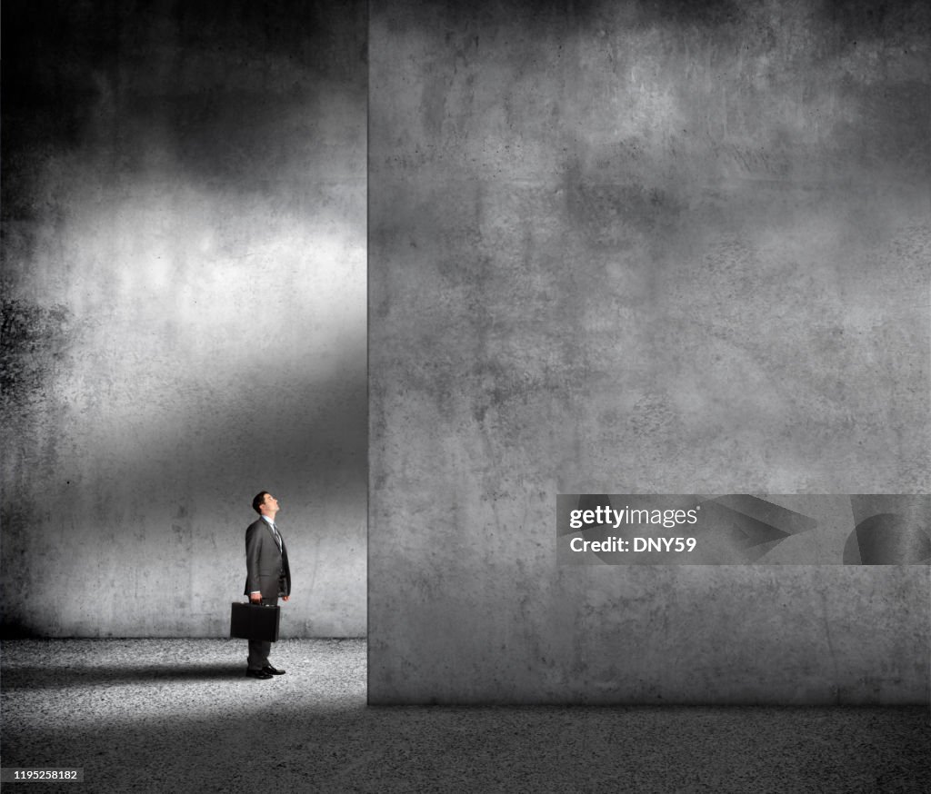 Small Businessman In Overwhelming Environment