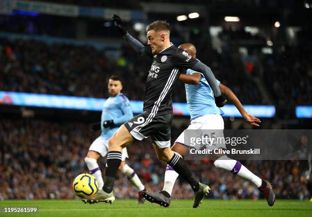 Jamie Vardy of Leicester City scores his team's first goal during the Premier League match between Manchester City and Leicester City at Etihad...
