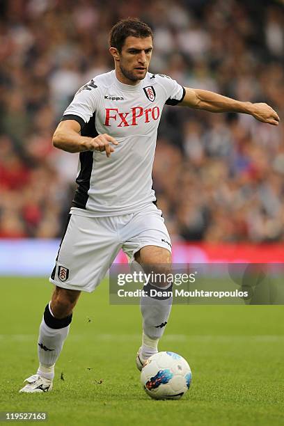 Aaron Hughes of Fulham passes the ball during the UEFA Europa League 2nd Qualifying Round 2nd Leg match between Fulham and Crusaders at Craven...